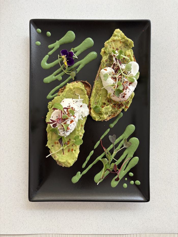 Avoholic: smashed avocado, poached eggs, sprouts and chilli flakes.