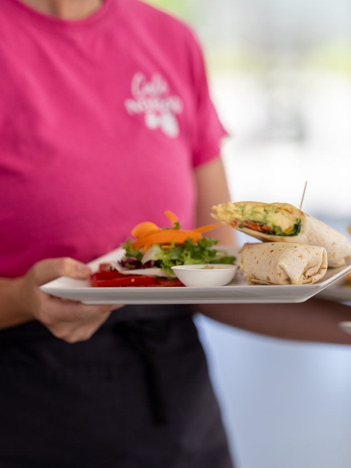 A server with two plates during service.